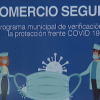 Cartel de 'comercio seguro' en un establecimiento de Badajoz capital
