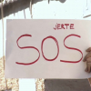 Cartel que pide "SOS JERTE" y que porta un vecino manifestándose contra los cortes de agua en la localidad