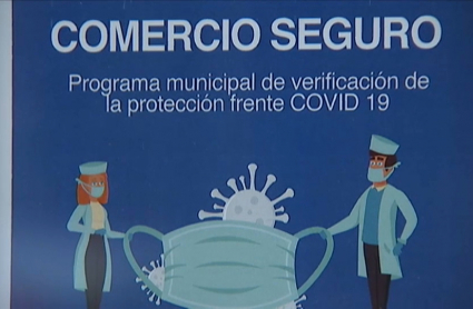Cartel de 'comercio seguro' en un establecimiento de Badajoz capital